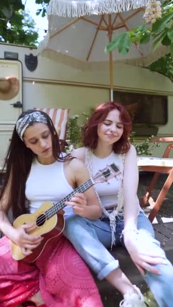 Two Beautiful Hippie Girls Singing Song Sitting Terrace Trailer Guitar — Video