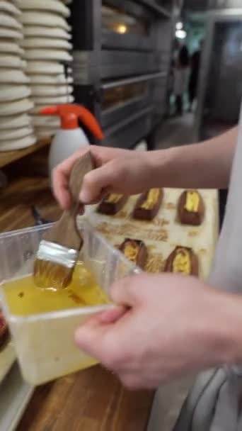 Baker Glazing Freshly Baked Rolls Syrup High Quality Fullhd Footage — Stock Video