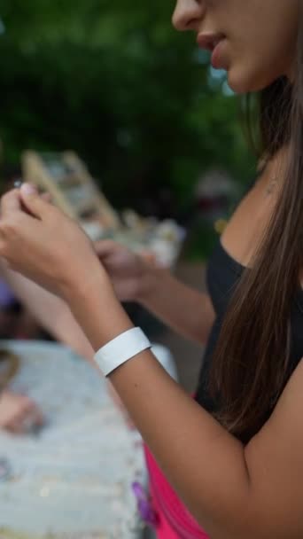 Exuberant Girl Rosy Wristbands Her Arms Fitting Bracelet Accessories Fair — Stock Video