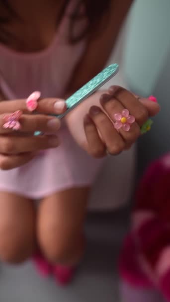 Girl Dressed Doll Style Pink Dress Using Nail File Perform — Stock Video