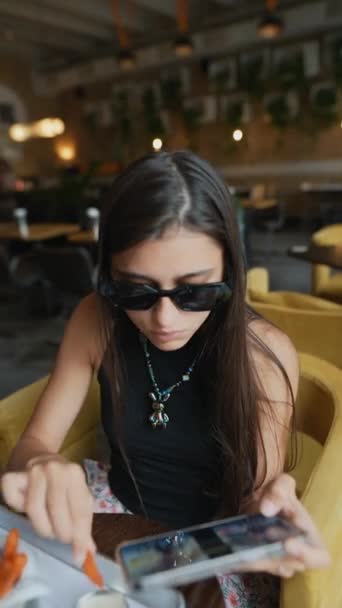 Young Woman Enthusiastically Playing Game Her Smartphone Lunch Restaurant High — Stock Video