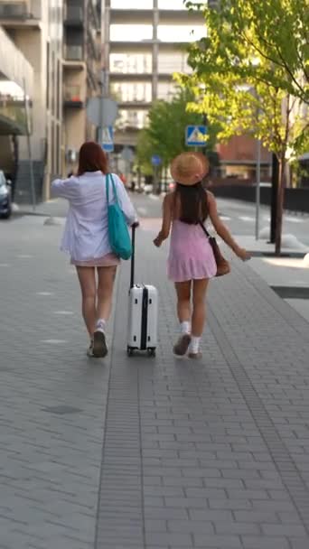 Stunning Young Ladies Navigating City Streets While Toting Suitcase Bags — Stock Video