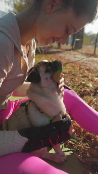 Sun Shining Young Woman Her Pug Share Joyful Embrace Park — Stock Video