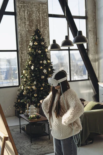 Amidst Festive Atmosphere Young Lady Light Attire Headset Observes Herself Stock Image