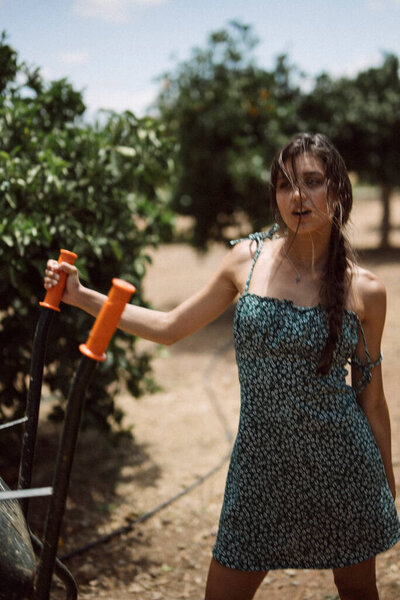 Woman Wearing Blue Dress Holding Garden Tools Green Foliage Trees Royalty Free Stock Images