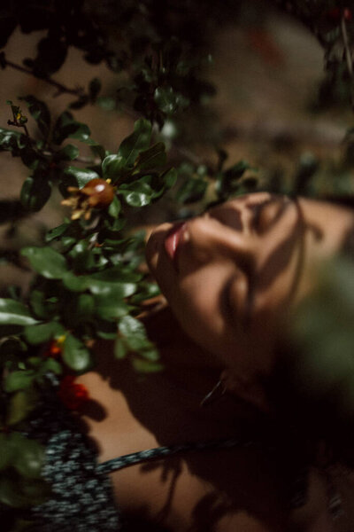 Portrait Woman Closed Eyes Surrounded Leaves Sunlight Creating Serene Nature Royalty Free Stock Images