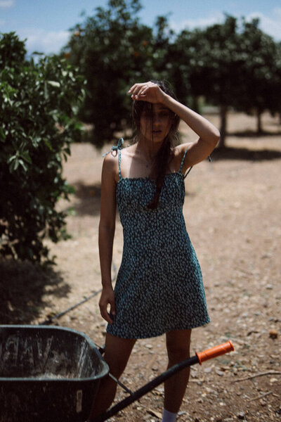 Young Lady Blue Dress Shields Her Eyes Sun Serene Rural Royalty Free Stock Photos
