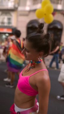 A lively scene capturing the spirit of a vibrant pride parade with colorful outfits and joyful energy.