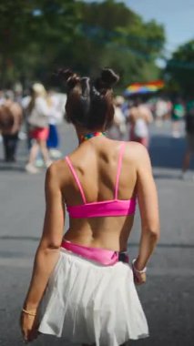 A talented dancer shines at a lively parade, showcasing joy and selfexpression in vibrant festive attire
