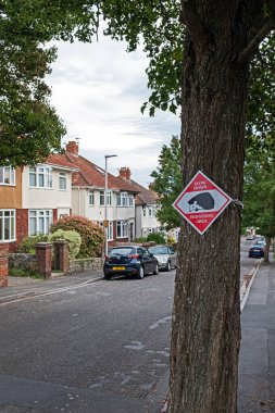 A sign warning drivers of the presence of hedgehogs (Erinaceus europaeus) on a suburban street in Weston-super-Mare, UK