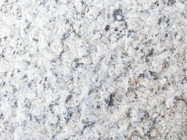Bright white rough granite for backgrounds, backdrops, wallpapers.