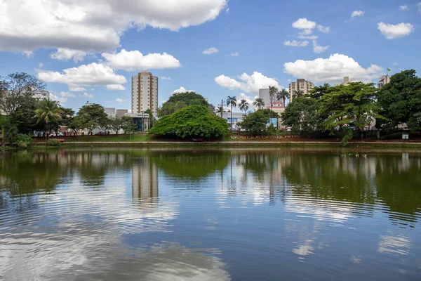 stock image A landscape of one of the lakes of Bosque dos Buritis in the city of Goinia. The lake with trees and blue sky with some clouds.