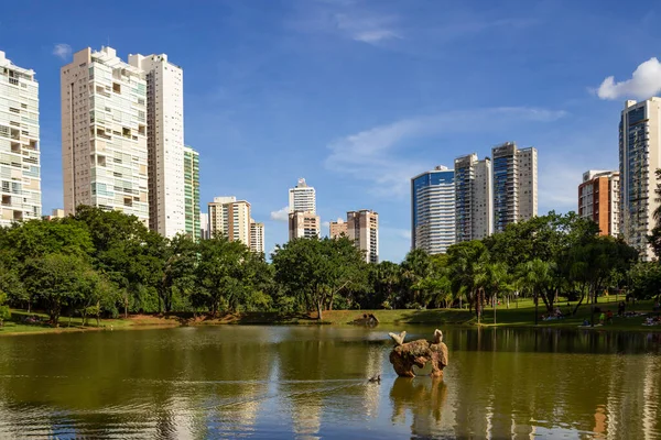 stock image Flamboyant Park, with buildings and reflections in the water of the lake.