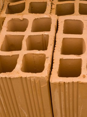 Close up of a set of bricks arranged and stacked for sale. clipart