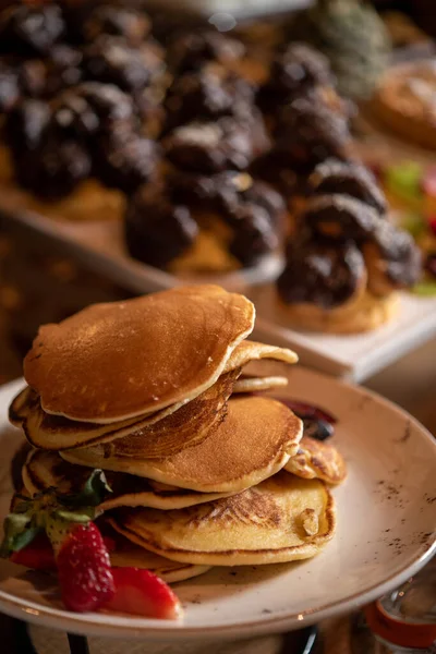 Pancakes Strawberries Chocolate Eclairs Background — Stock Photo, Image
