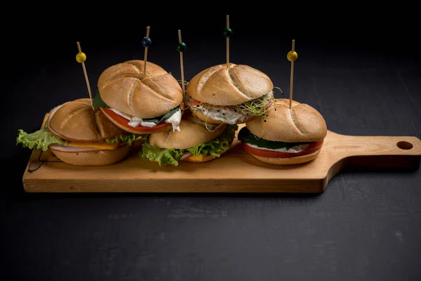 Delicious Burgers Pierced Wooden Sticks Served Wooden Board — Stock Photo, Image