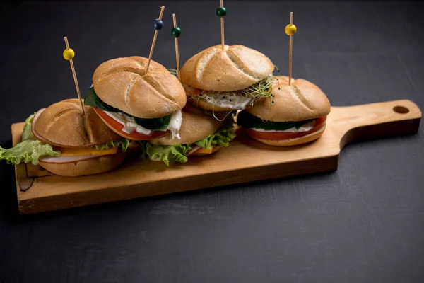 Delicious Burgers Pierced Wooden Sticks Served Wooden Board — Stock Photo, Image