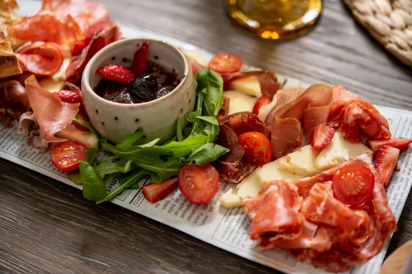 Delicious antipasti platter served with jam