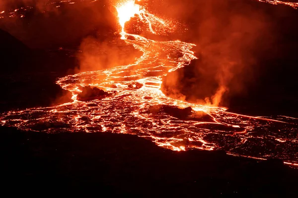 Steaming lava river landscape at night, Iceland