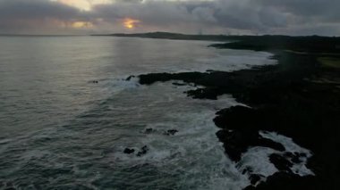 Iceland rocky coastline aerial over breaking waves