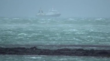 Fishing trawler enduring rough Icelandic weather