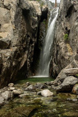 Register Creek Falls Off of Cliff into Pool Below in Yosemite