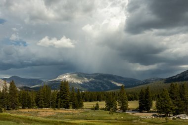 Storm Clouds Moving In Over The Mountains Surrounding Tuolomne Meadows in Yosemite National Park