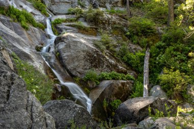 Ella Falls in Kings Canyon tumbles over rocks in early summer