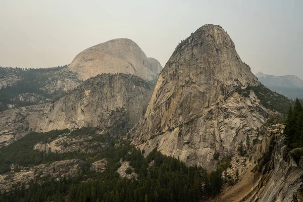 Liberty Cap Mount Broderick Half Dome Distance Smoky Day Yosemite — стокове фото