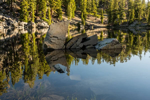 stock image Wind Caused Ripples Form Around The Rocks Of Terrace Lake in Lassen Volcanic National Park