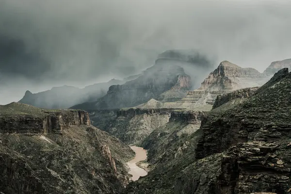 Muted Colors of Snow Storm Over The Colorado River In The Grand Canyon in April