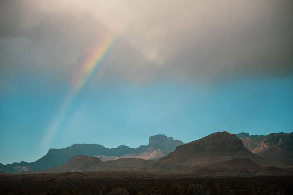 Rainbow Arches Over Chisos Mountains In Big Bend National Park