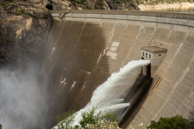 Water Rushes Through Vents out of OShaunessy Dam at Hetch Hetchy clipart