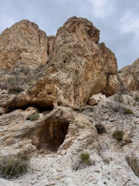 Small Cave At The Base Of Rock Formation In Big Bend National Park clipart