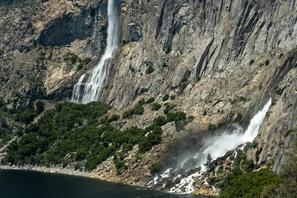 stock image Tueeulala and Wapama Falls Rush Towards Hetch Hetchy Resevoir in Yosemite