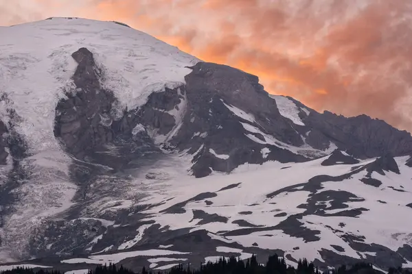 stock image Glaciers Hold Tight To The Top Of Mount Rainier At Sunset in summer