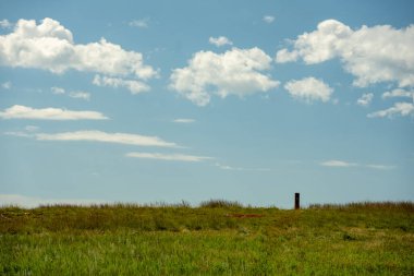 Trail Marker Silhouetted Against The Sky In Wind Cave National Park clipart