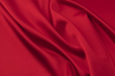 Arkaplan olarak kırmızı saten veya ipek kumaş