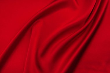 Arkaplan olarak kırmızı saten veya ipek kumaş