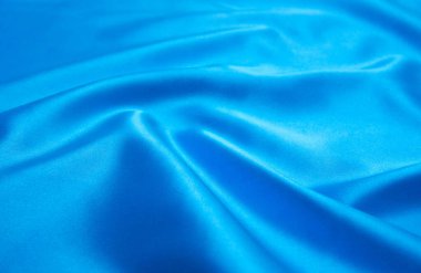 Pürüzsüz mavi ipek arka plan olarak kullanılabilir