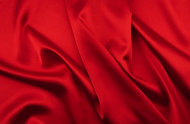 Arkaplan olarak kırmızı saten veya ipek kumaş