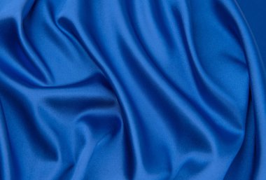 Arkaplan olarak mavi saten veya ipek kumaş