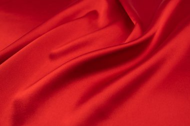Arkaplan olarak kırmızı saten veya ipek kumaş