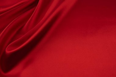 Arkaplan olarak kırmızı saten veya ipek kumaş