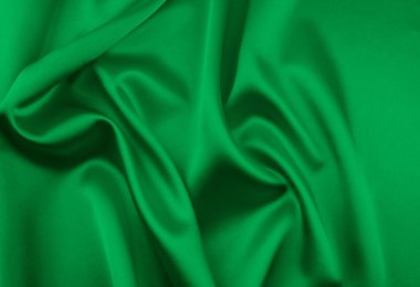 Arkaplan olarak yeşil saten kumaş