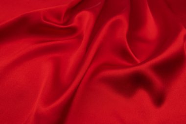 Arkaplan olarak kırmızı saten veya ipek kumaş