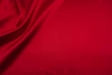 Arkaplan olarak kırmızı saten veya ipek kumaş
