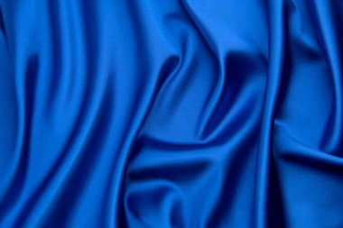 Arkaplan olarak mavi saten veya ipek kumaş