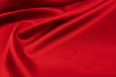 Arkaplan olarak kırmızı saten veya ipek kumaş