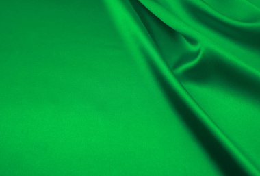 Arkaplan olarak yeşil saten kumaş